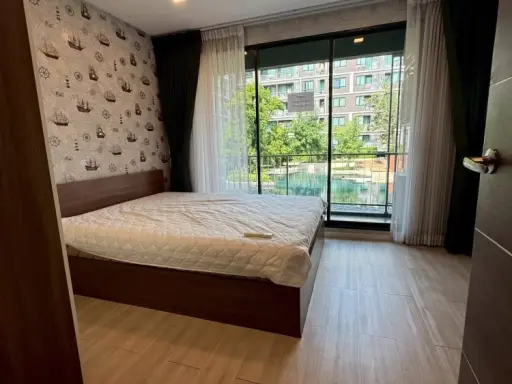 For rent: Atmoz Ladprao 71, 2 bedrooms, spacious living area, beautiful wallpaper, fully furnished. Book now!