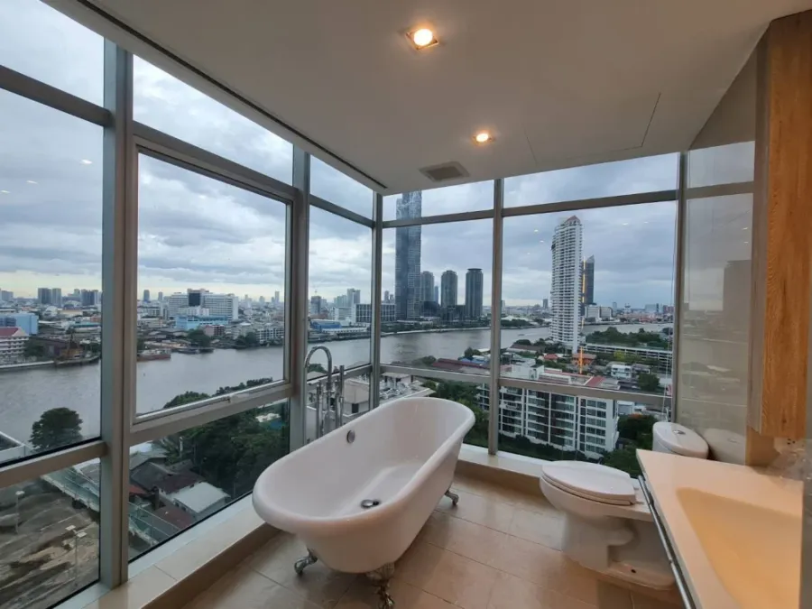 For rent: Sathorn - Chao Phraya house, corner unit with stunning Chao Phraya river bend view, fully furnished with built-in features. Don't miss out!
