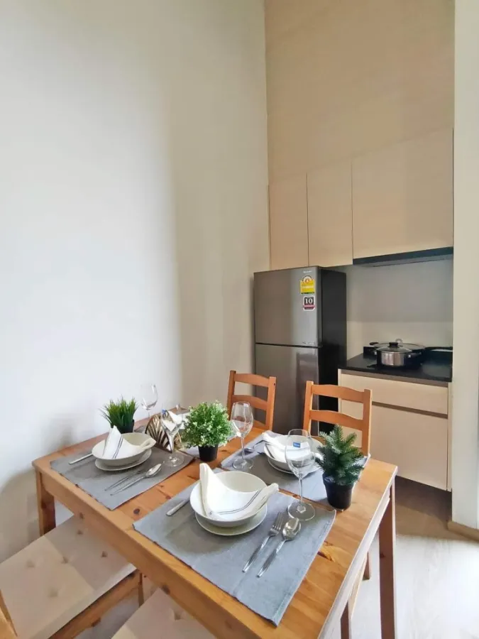 Condo for sale or rent: Noble Revolve Ratchada 2. The living room balcony is very wide next to the swimming pool.