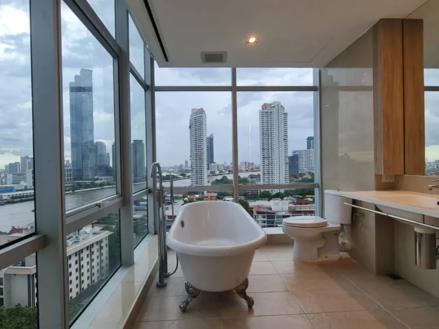 For rent: Sathorn - Chao Phraya house, corner unit with stunning Chao Phraya river bend view, fully furnished with built-in features. Don't miss out!