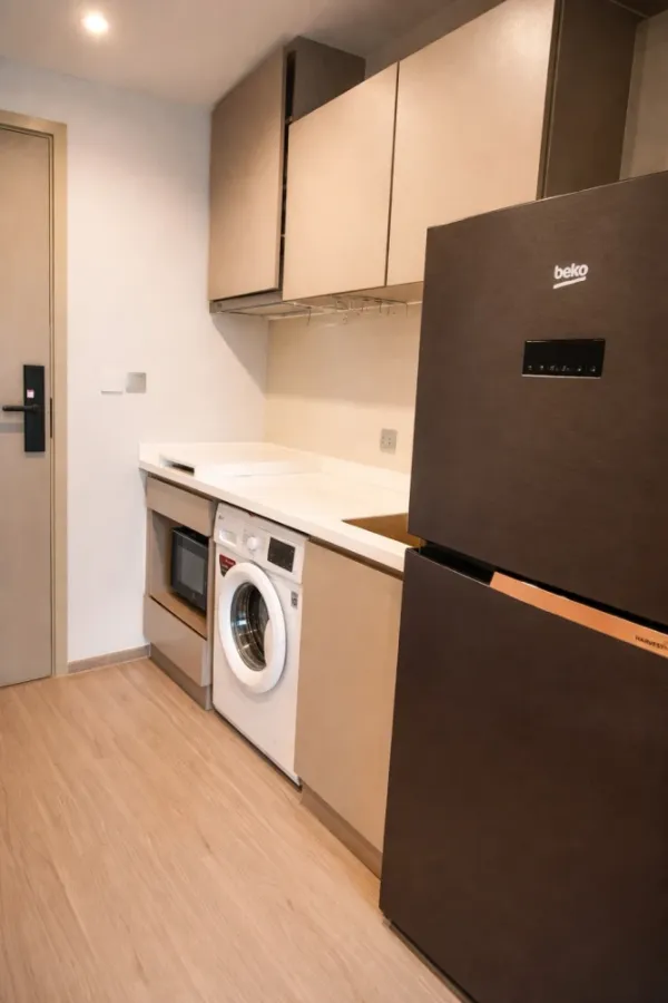 For rent: Life Ladprao condo with multi-functional furniture. The well-designed furniture maximizes space, making the room feel spacious, airy, and in