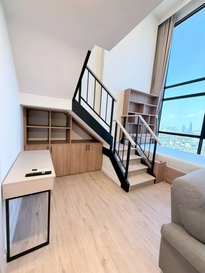 For rent: XIM Suksawat - Rama 3. Spacious room with high ceilings, airy feel, high-quality built-in furniture, and beautiful view. Book now!