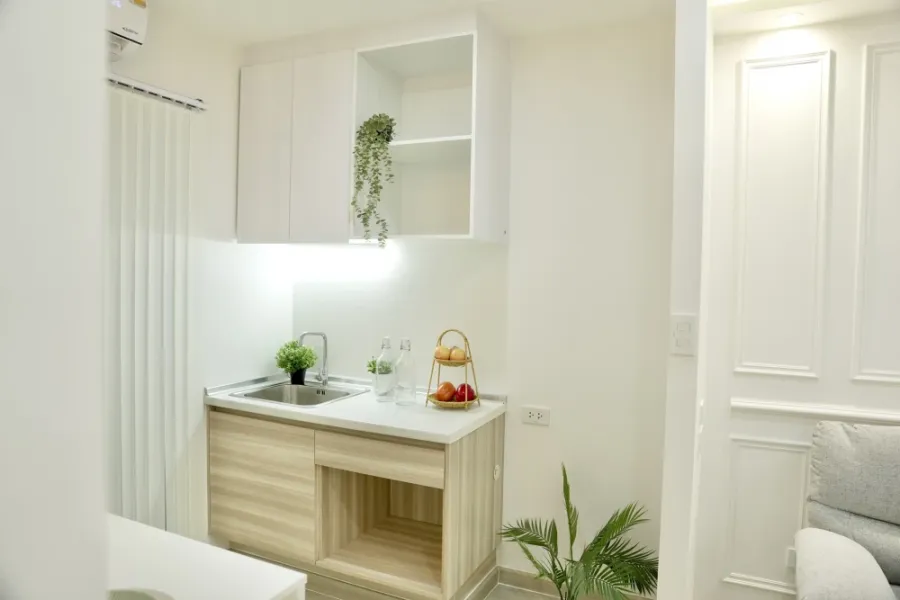 Selling Plum Condo Chaengwattana Station, Phase 2. Features include moisture-resistant and termite-proof SPC flooring, built-in cabinets for organized