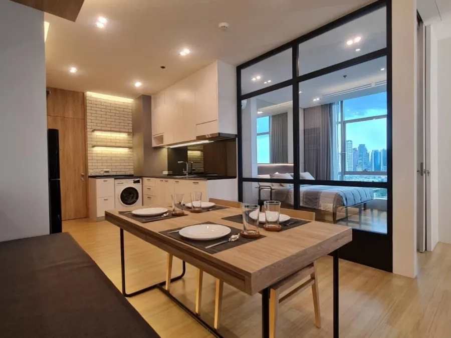 For rent: Sathorn - Chao Phraya house, corner unit with stunning Chao Phraya river bend view, fully furnished with built-in features. Don't miss out!