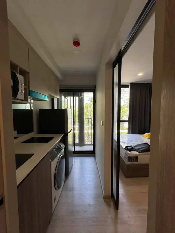 For rent: Nue Core Khu Khot Station, studio room, 2nd floor, fully furnished, includes washing machine. Don't miss out!