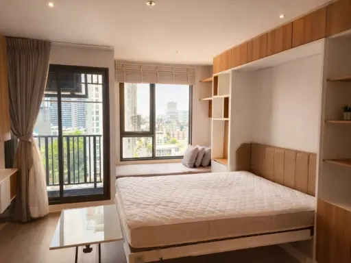 For rent: Life Ladprao condo with multi-functional furniture. The well-designed furniture maximizes space, making the room feel spacious, airy, and in
