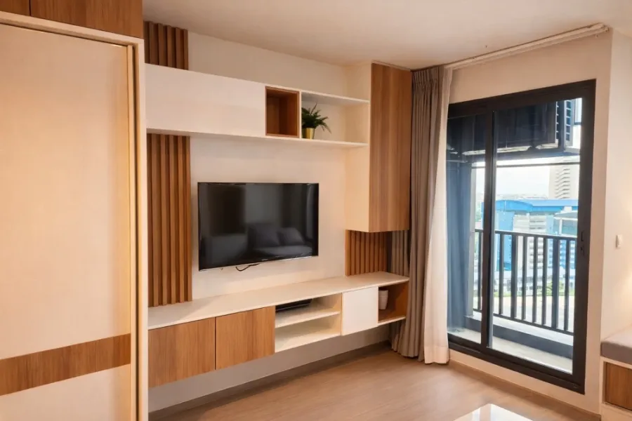 For rent: Life Ladprao condo with multi-functional furniture. The well-designed furniture maximizes space, making the room feel spacious, airy, and in