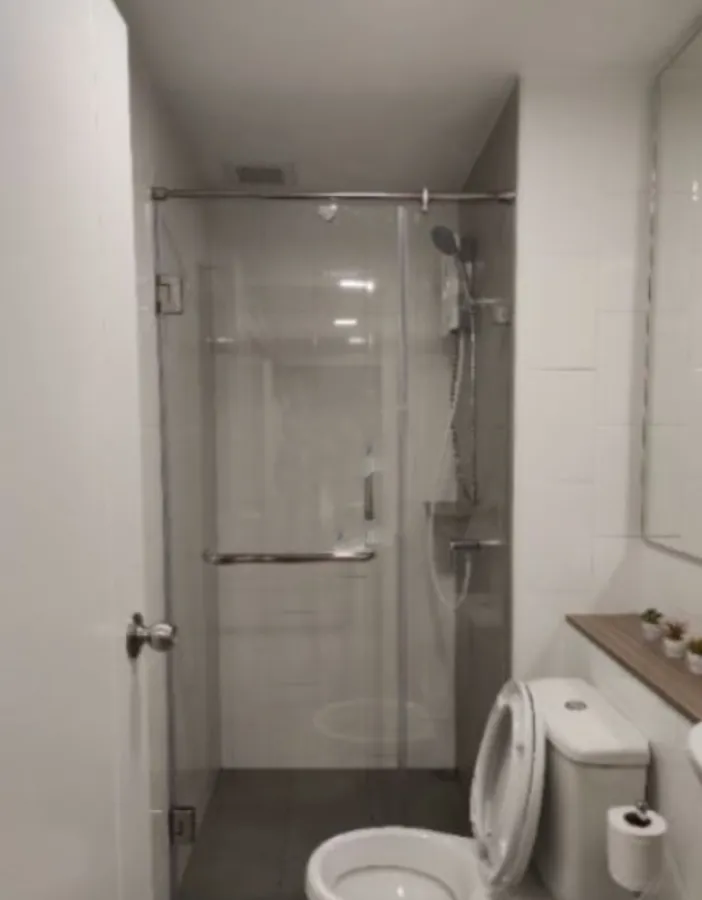 For rent Plum Condo Rangsit Alive Phase 1 pool view south room window Decorate the room with a mirror behind the sofa.