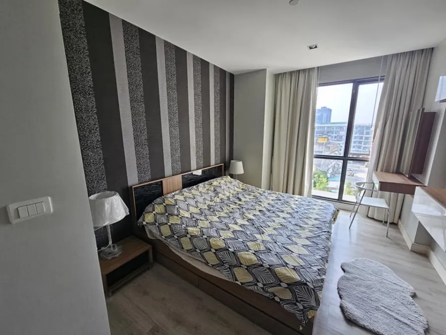 For rent: The Room Sukhumvit 62, bedrooms with awesome wallpaper. The view saw many shady trees. Let me tell you, you have to make a reservation.