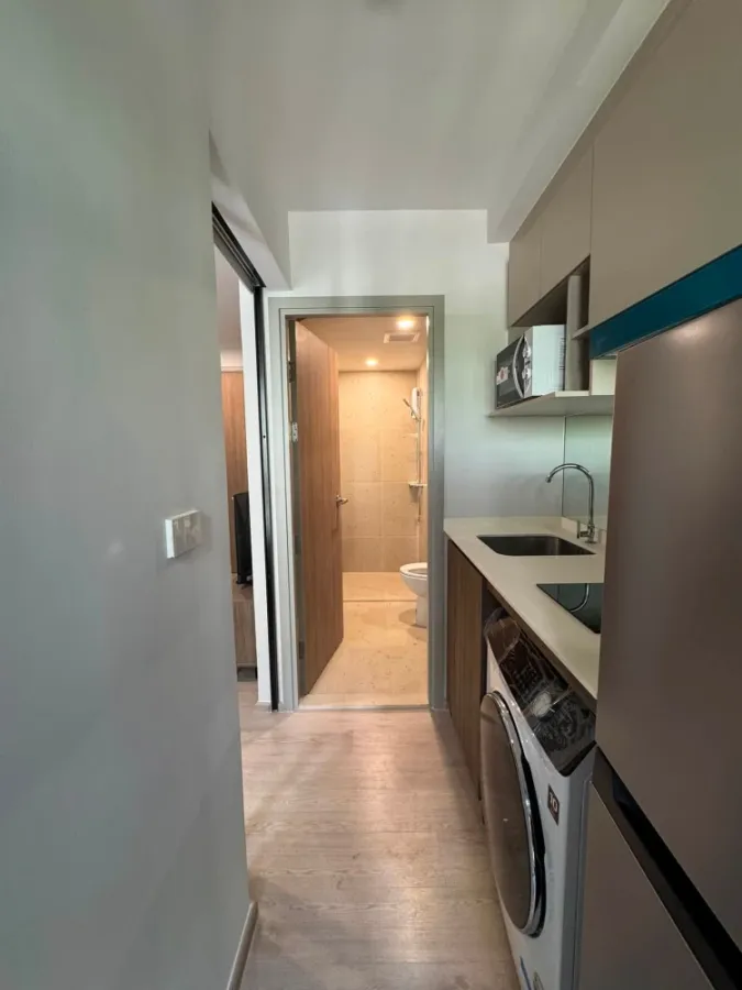 For rent: Nue Core Khu Khot Station, studio room, 2nd floor, fully furnished, includes washing machine. Don't miss out!