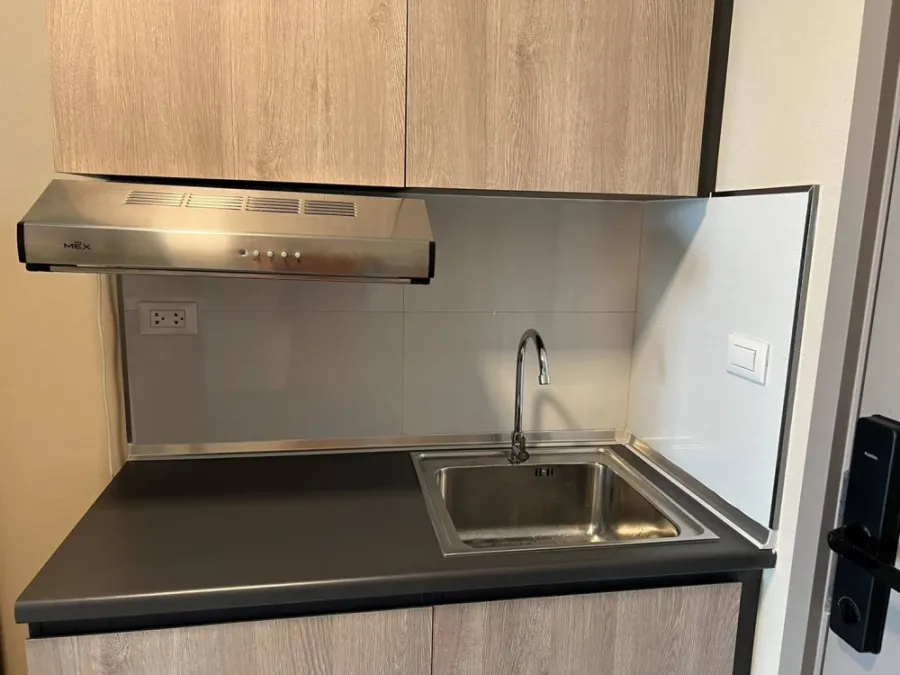For sale/rent: D Condo Hideaway Rangsit Phase 4. There is a glass door separating the bedroom and kitchen. Very attractive.