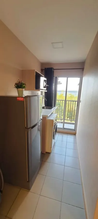 For rent: Plum Condo Rangsit Alive Phase 1, near Bangkok University, 4th floor, Building D. Fully furnished with appliances, ready to move in.