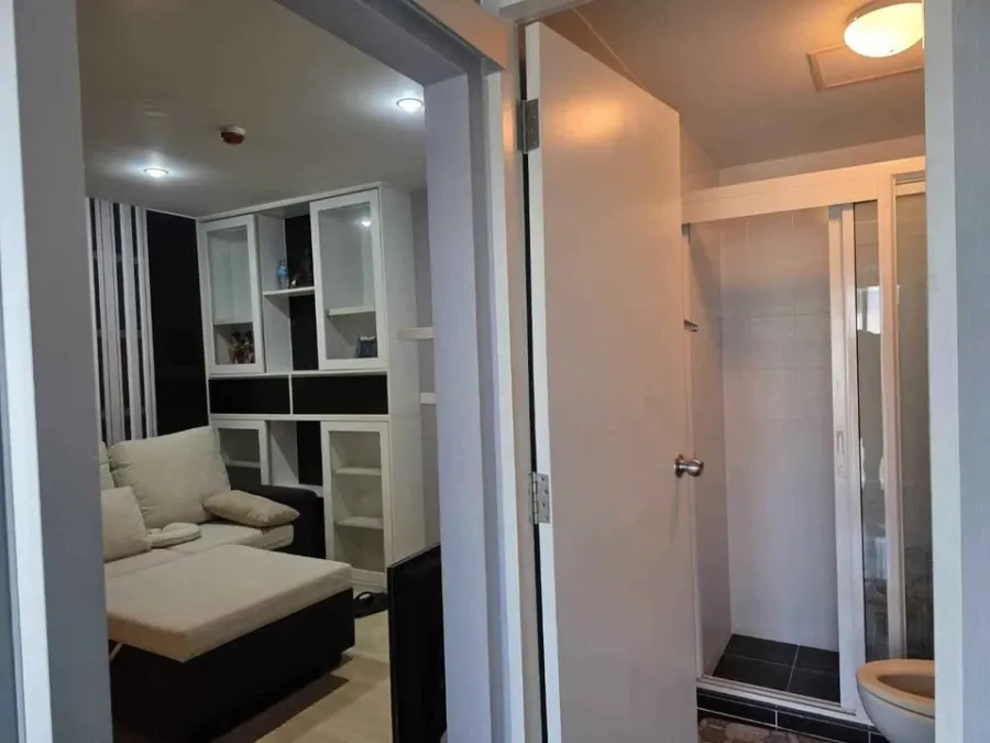 Best-selling condo in Ramintra, with partition doors separating the rooms and fully furnished with built-in furniture, ready to move in.