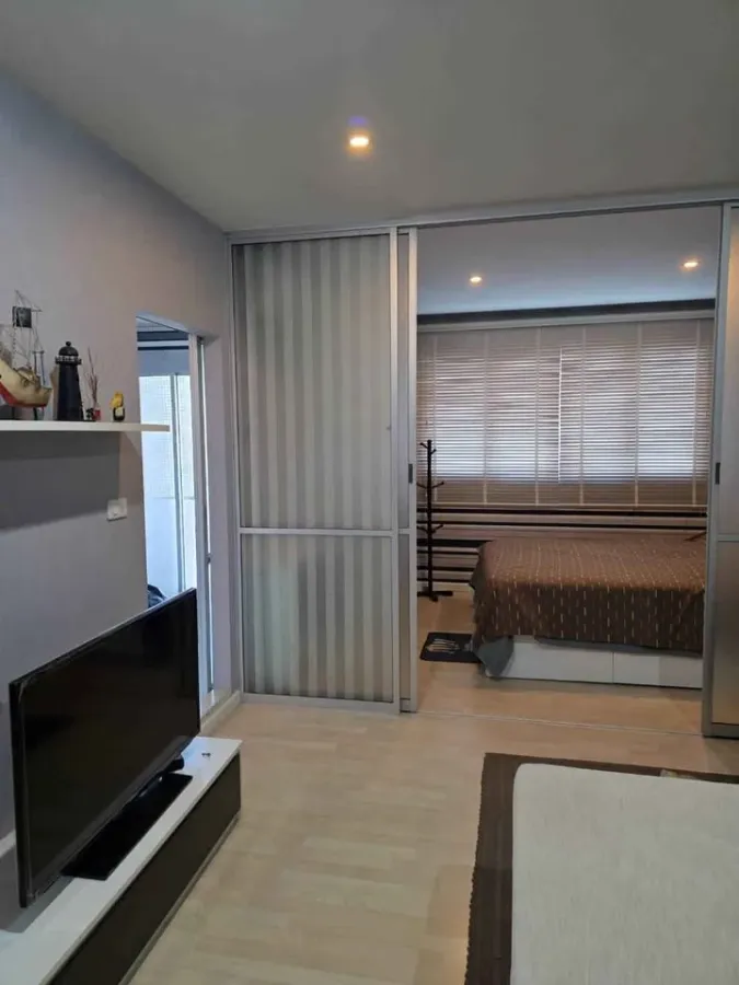 Best-selling condo in Ramintra, with partition doors separating the rooms and fully furnished with built-in furniture, ready to move in.