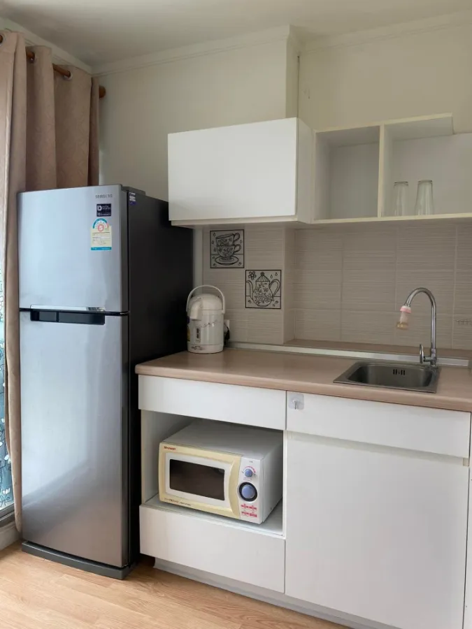 Condo for rent, Lumpini Ville Chaengwattana-Pak Kret, room on the 17th floor, city view of Thong Thani. Plus a washing machine