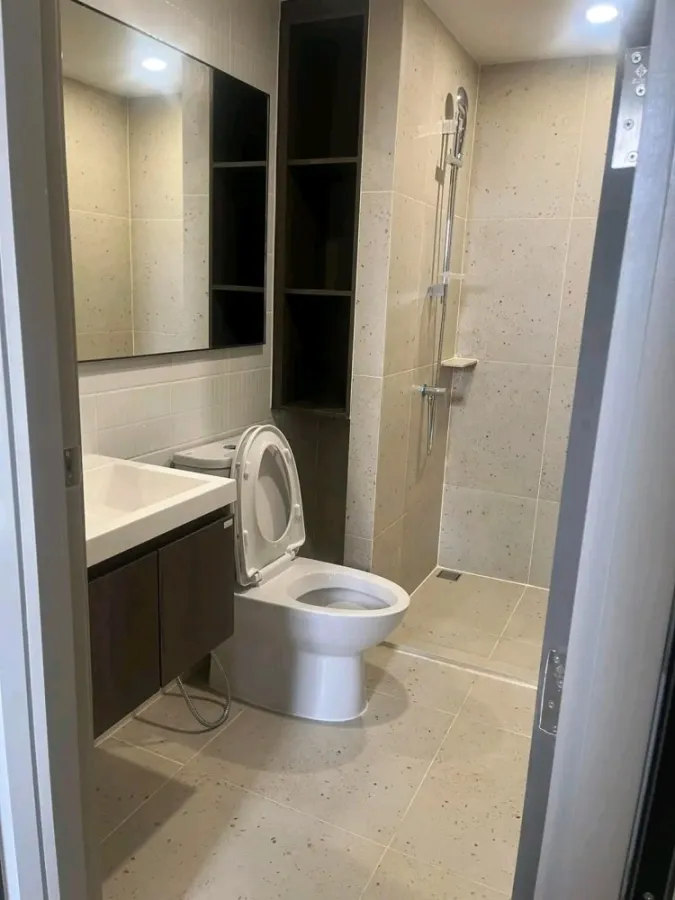 Condo down payment for sale, New Cross Khu Khot Station, studio room, 7th floor, BTS view, building next to the road, buy now.