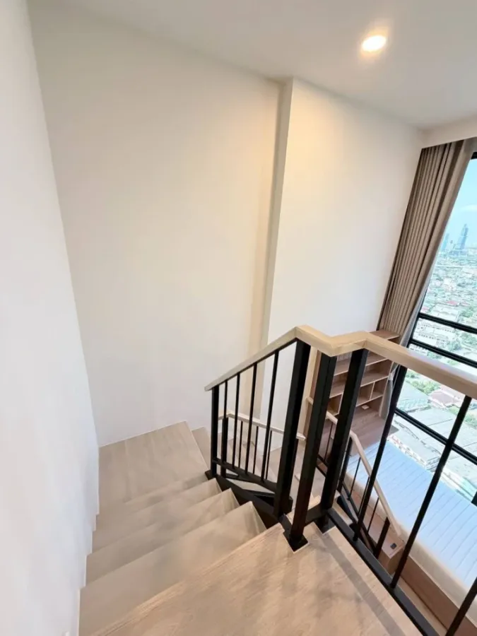 For rent: XIM Suksawat - Rama 3. Spacious room with high ceilings, airy feel, high-quality built-in furniture, and beautiful view. Book now!