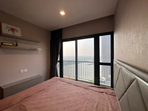 Condo for rent at Politan Rive, corner unit overlooking the Chao Phraya River, 31st floor, fully furnished. Book now! images
