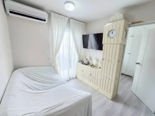 Plum Condo Ramkhamhaeng 60 for sale. Large unit, quiet, pool view. Beautiful white and cream built-in furniture. Don't miss out!