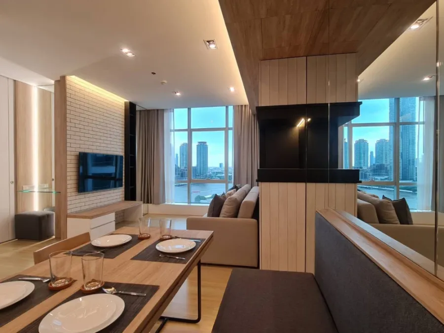 For rent: Sathorn - Chao Phraya house, corner unit with stunning Chao Phraya river bend view, fully furnished with built-in features. Don't miss out!