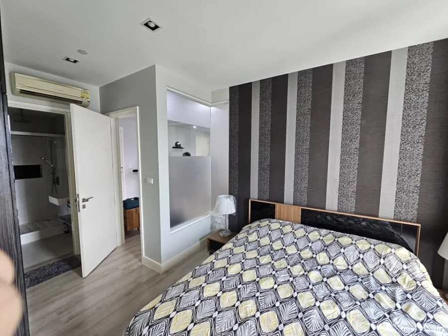 For rent: The Room Sukhumvit 62, bedrooms with awesome wallpaper. The view saw many shady trees. Let me tell you, you have to make a reservation.
